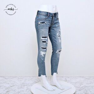 American Eagle Super Stretch Low Waist Distressed Raw Hem Jeggings